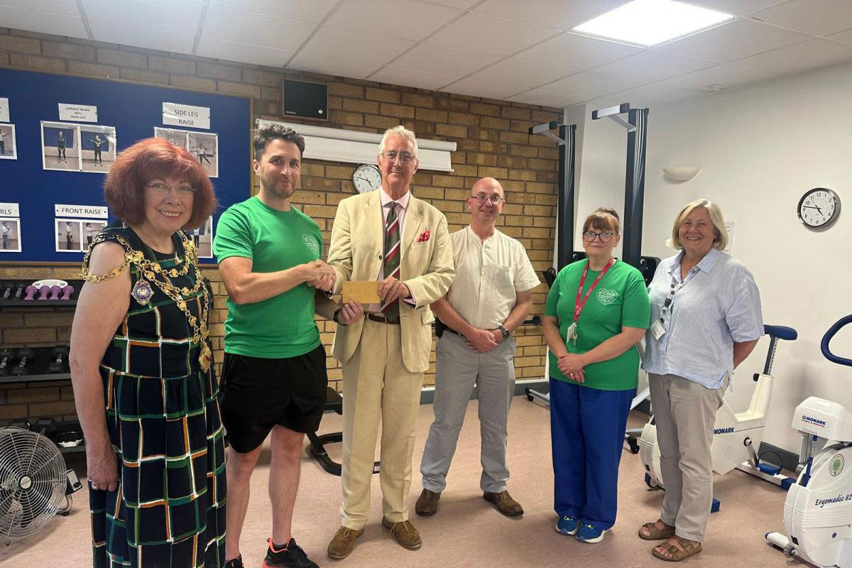 Presentation party, left to right: Linda Edmunds MBE, Ceri Kostin, Peter Heathcote, Brigadier Robert, Aitken, CBE, HM Lord Lieutenant of Gwent, Brian Begg, and the Rt Hon Kate Thomas, Lord Mayor of Newport, present a cheque for £2171 towards cardia